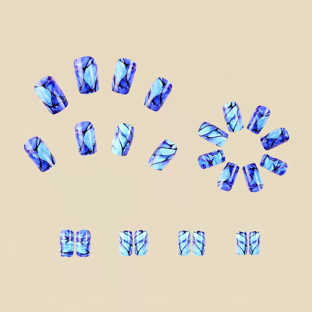 Acrylic nail set with luxurious marble design and elegant accents Bowlift