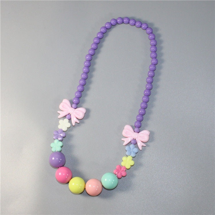Colorful pearl necklace with floral elements Bowlift