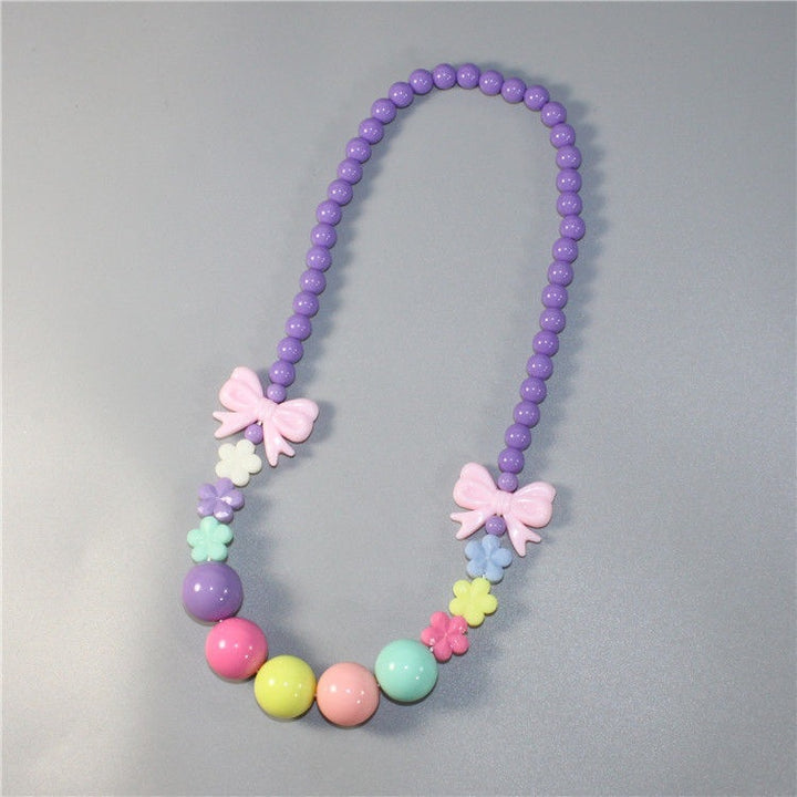 Colorful pearl necklace with floral elements Bowlift