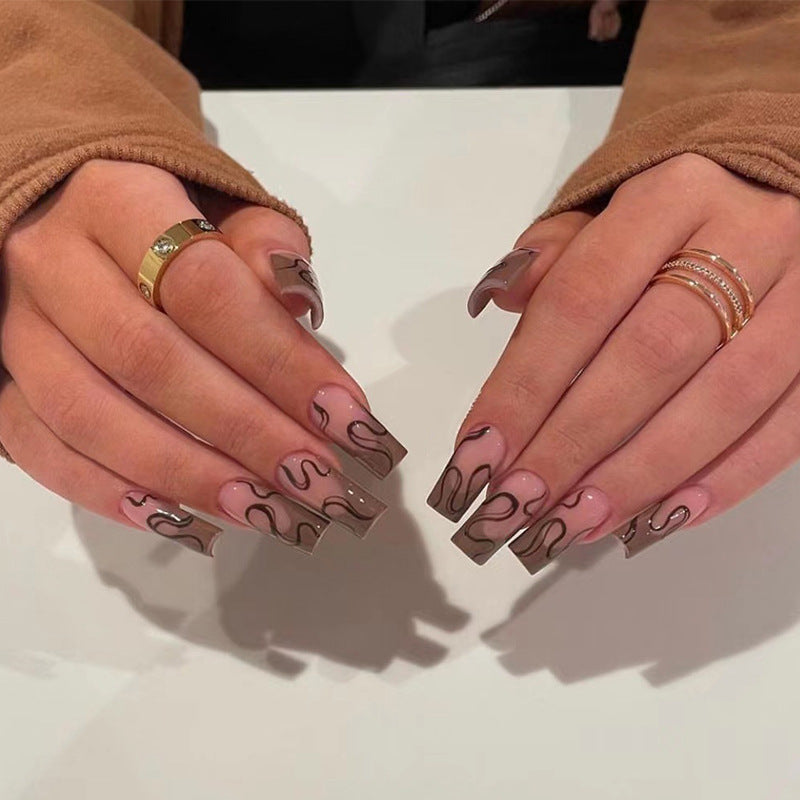 Artful Gel Nails with Elegant Floral Design and Glitter Accents Bowlift