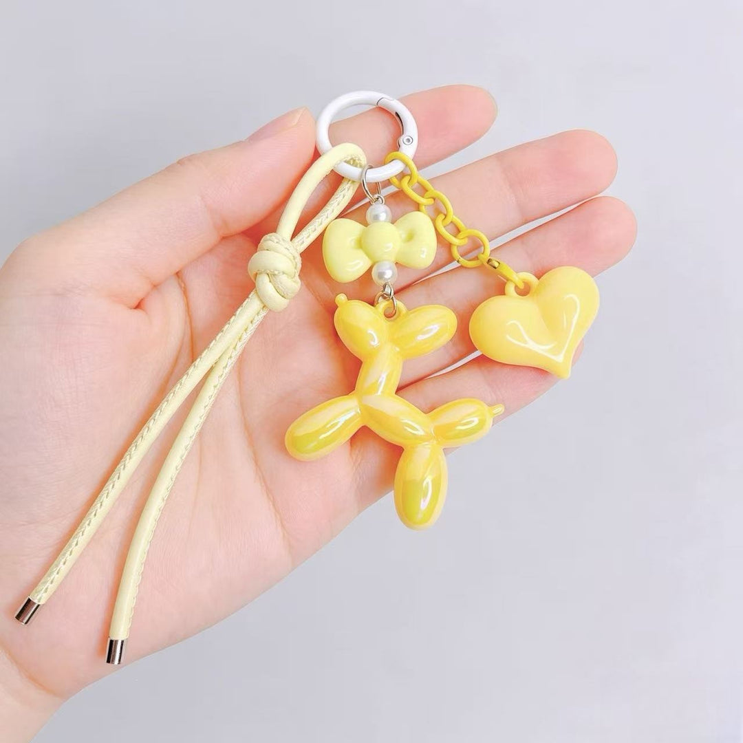 Playful keychain with heart and balloon dog Bowlift