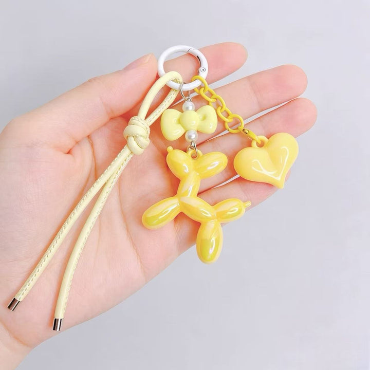 Playful keychain with heart and balloon dog Bowlift