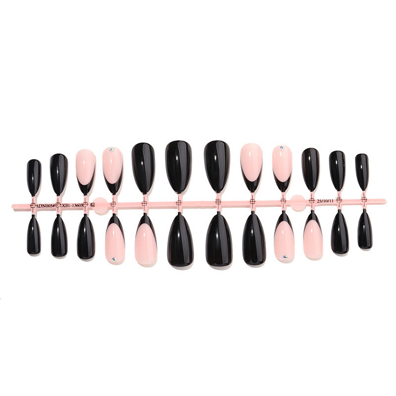 Acrylic nail set with elegant black-pink design and rhinestone-embellished accents Bowlift