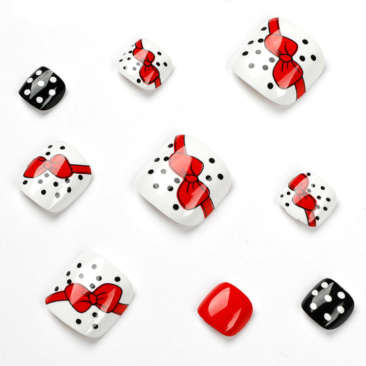 Artful toenail design with elegant bow motifs Bowlift