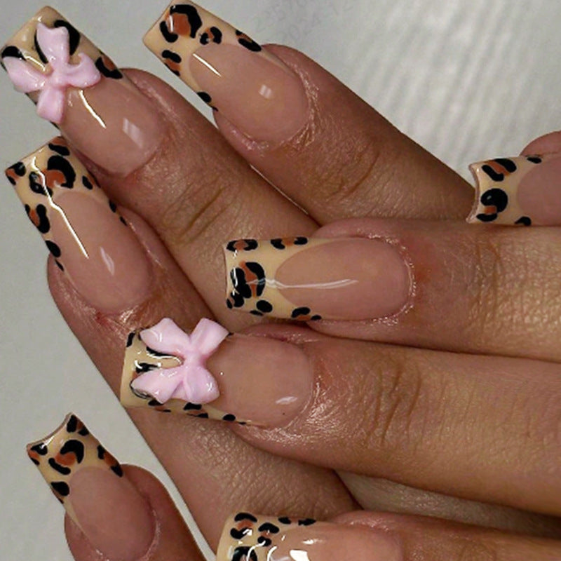 Decorative Stiletto Press-On Nail Art with Animal Print and Bow Accents Bowlift
