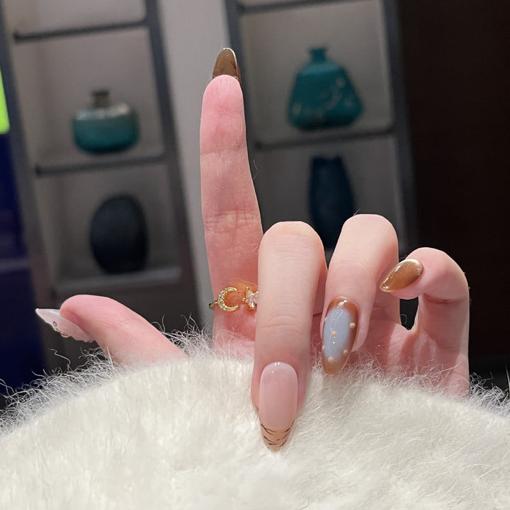 Artistic Press-On Nail Set with Unique Abstract Design Elements Bowlift