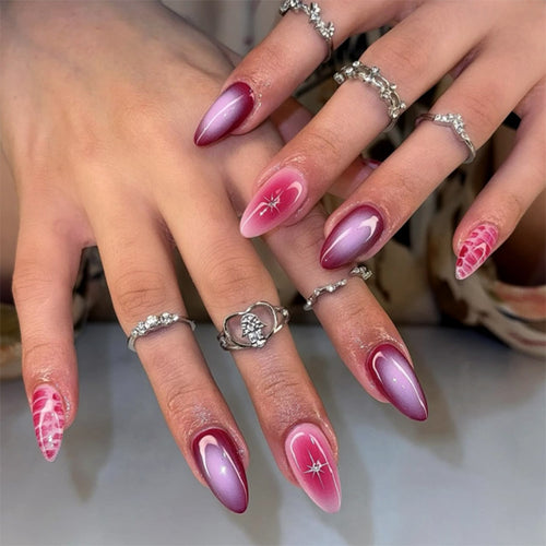 Artistic stiletto nails with elegant gradient and delicate accents Bowlift