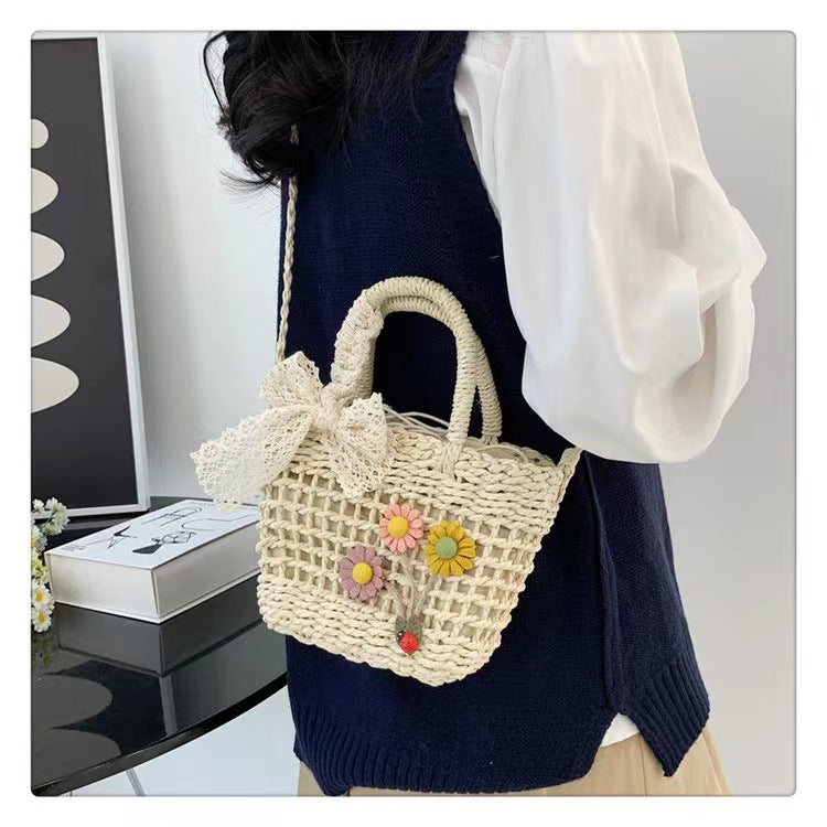 Playful basket bag with floral appliqués Bowlift