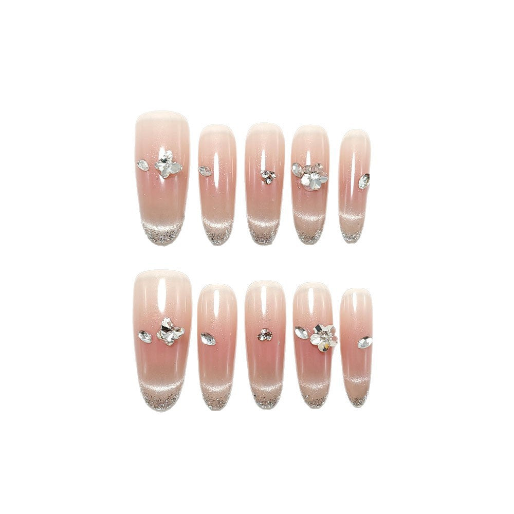 Glamorous artificial nails with glitter decorations Bowlift