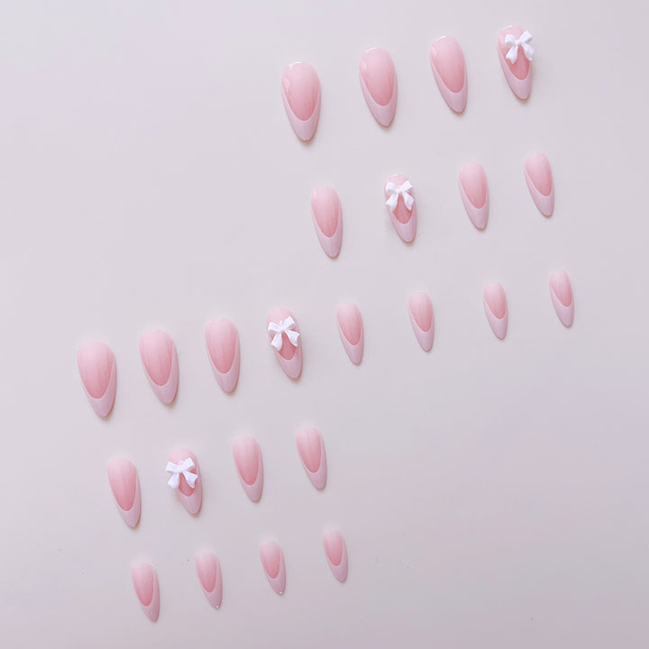 Artificial nail set with elegant tips and delicate bow decorations Bowlift