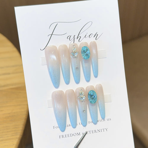 Glamorous artificial nails with sparkling rhinestone details Bowlift