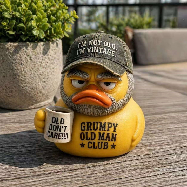 Funny rubber duck with vintage hat and cup Bowlift