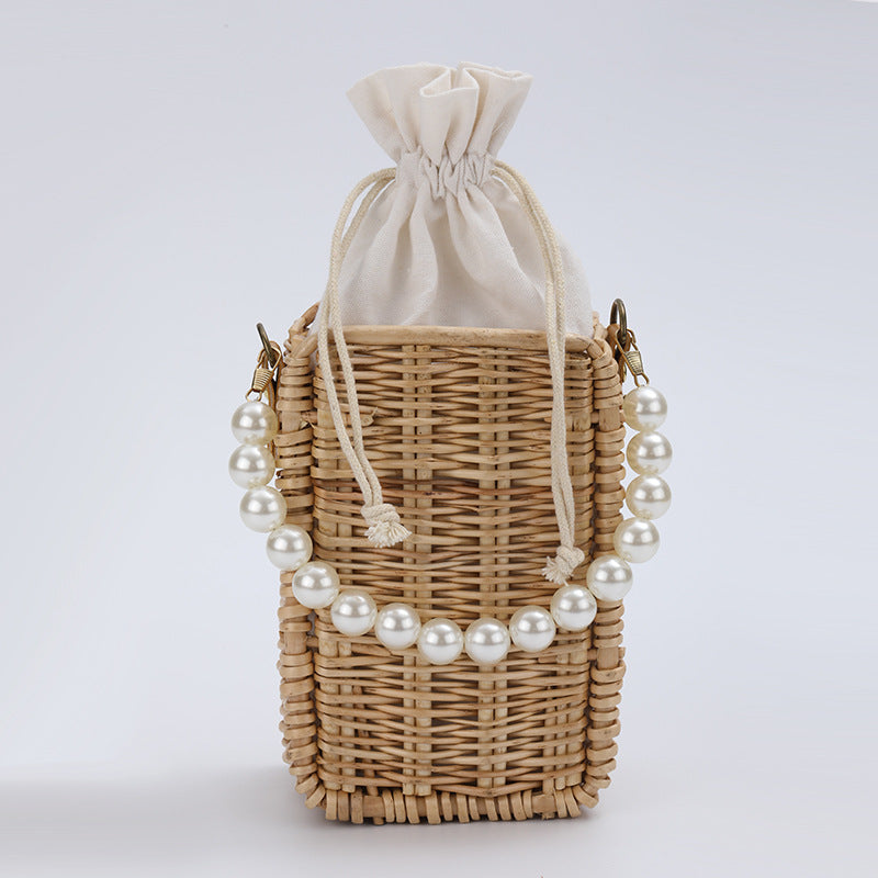 Women's handbag made of woven material with pearl accents Bowlift