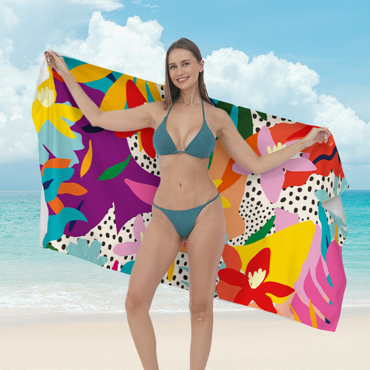 Beach towel with vibrant tropical plant motif Bowlift