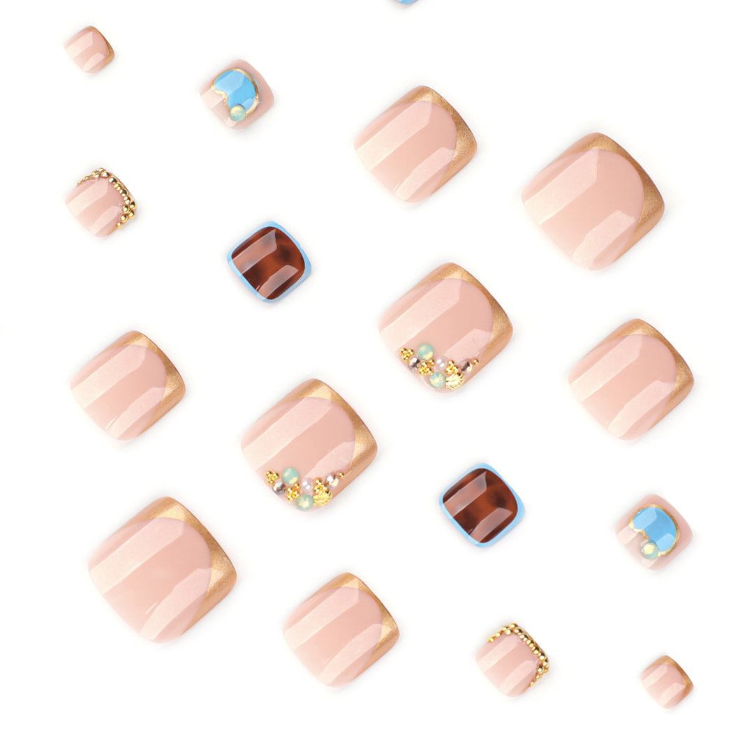 Artistic toenail art with elegant gold design Bowlift