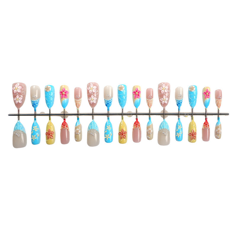 Elegant artificial nail set with floral details and glitter accents Bowlift