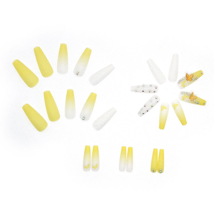 Artificial nail extensions with floral accents and rhinestones Bowlift