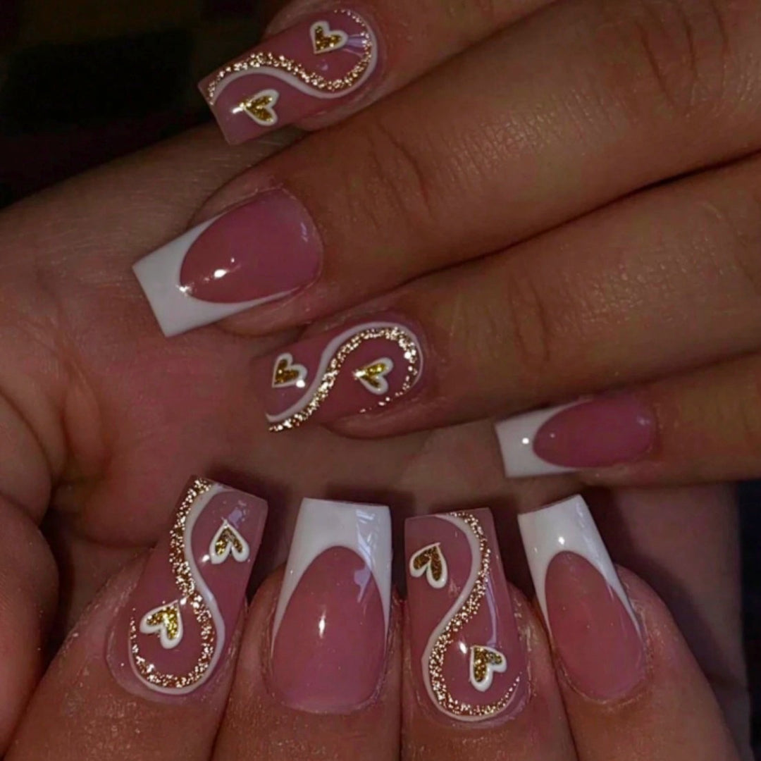 Artificial nail set with elegant heart decorations and glitter accents Bowlift