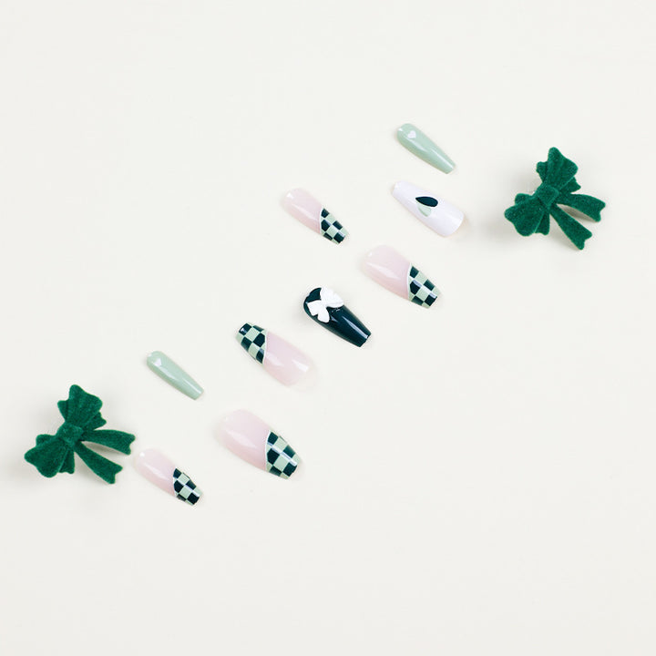 Artificial nail extensions with creative design and glitter accents Bowlift