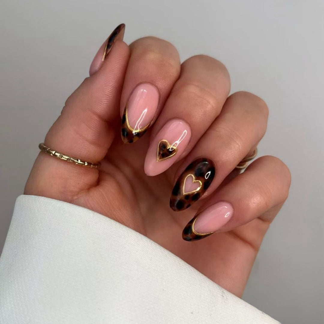 Artful stiletto nails with elegant heart design Bowlift