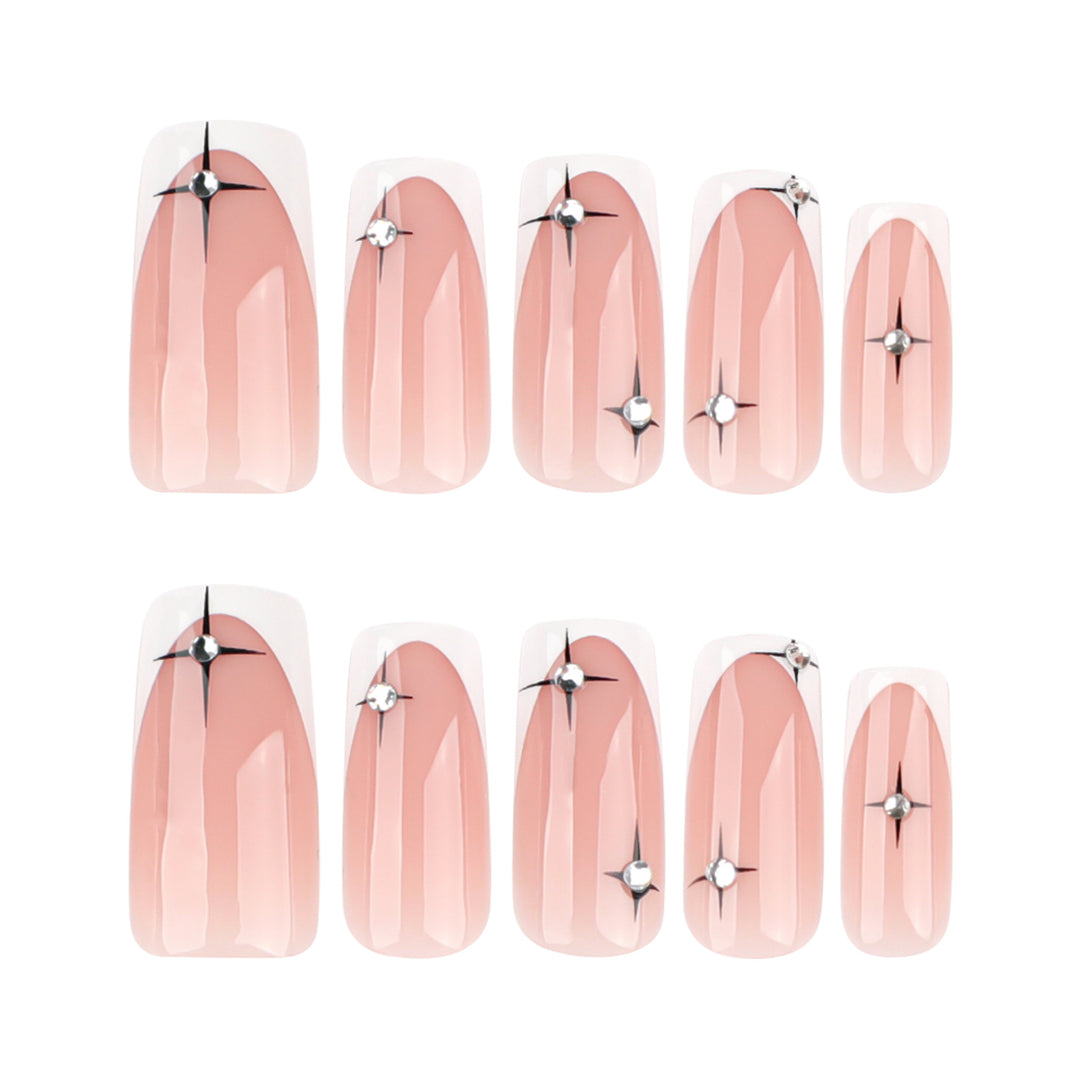 Artificial nail extensions with elegant French tip and glitter accents Bowlift
