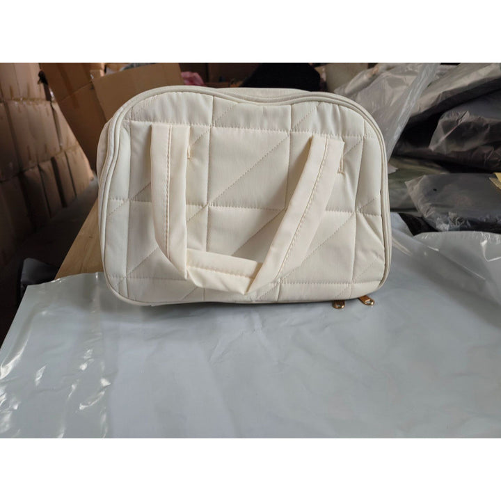 Cosmetic bag with padded interior compartment Bowlift