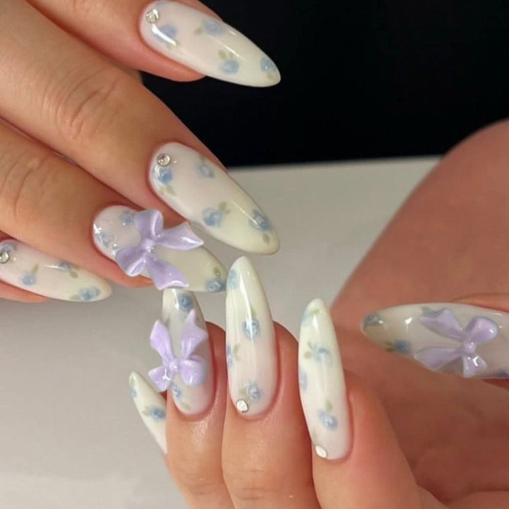 Artful Nail Art with Flower Design and Blue French Tip Bowlift