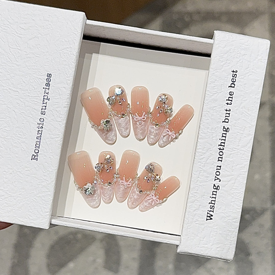 Artificial nails with romantic rhinestone details Bowlift