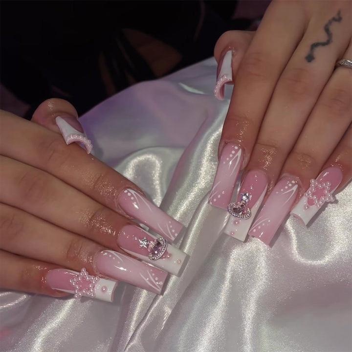 Creative acrylic nail set with delicate pearl and gloss accents Bowlift