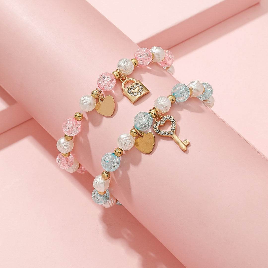 Playful bracelet set with heart and key design Bowlift