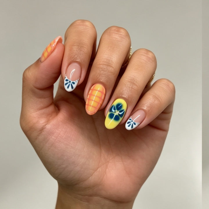 Artificial nails with colorful floral accents Bowlift