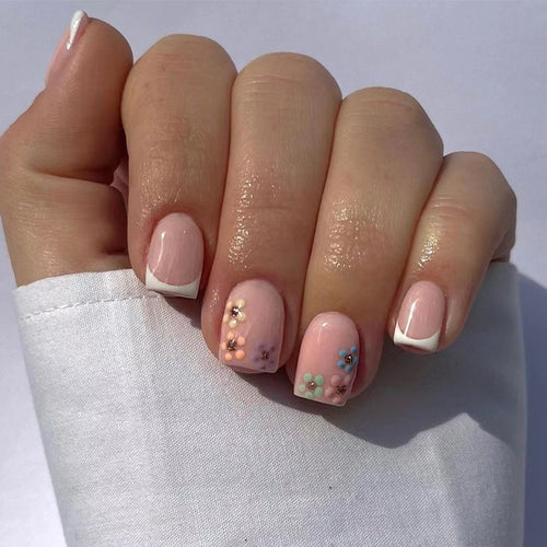 Artistic nail art with floral accent and elegant French tip Bowlift
