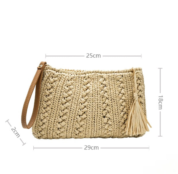 Woven natural material handbag with tassel Bowlift