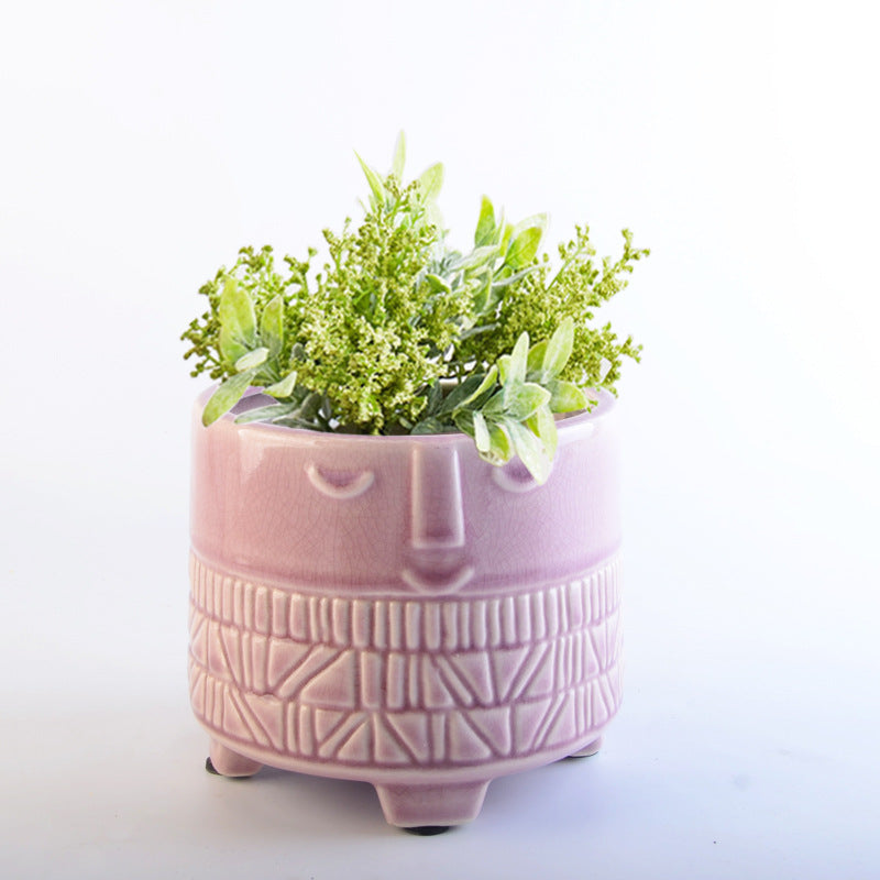 Decorative plant pot with facial features Bowlift
