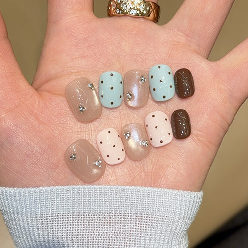 Acrylic nails with rhinestones and glitter Bowlift