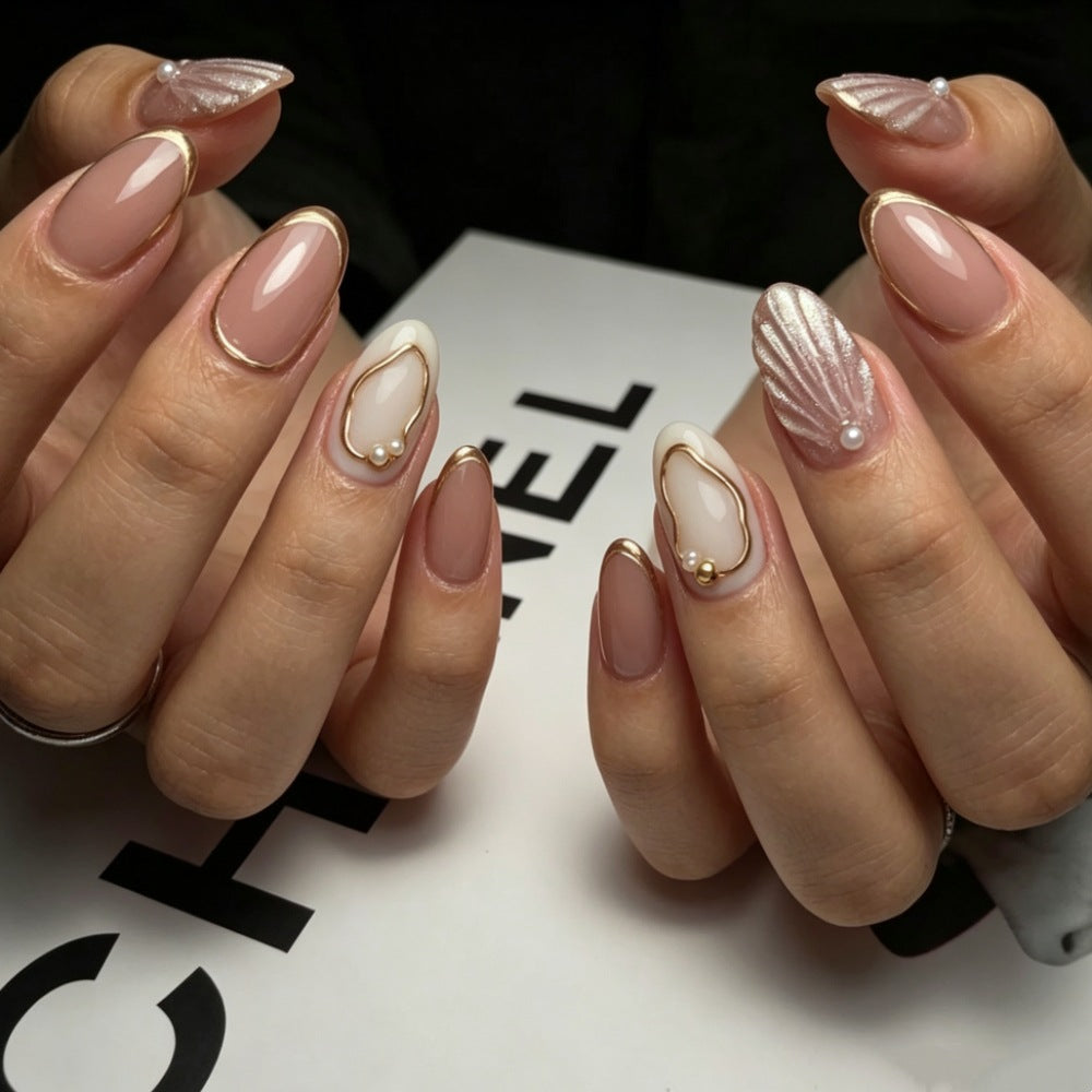Artistic Press-On Nail Design with Gold Embellishments Bowlift