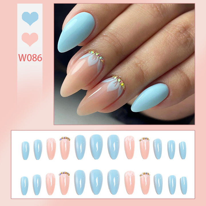 Artificial nails with elegant leaf patterns and rhinestone embellishments Bowlift