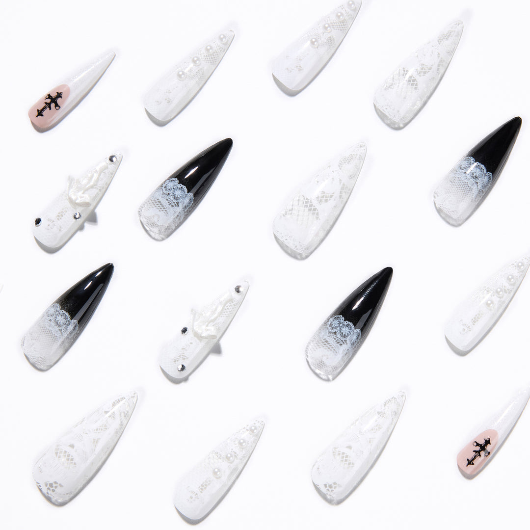 Artful stiletto nails with unique 3D elements and glitter accents Bowlift