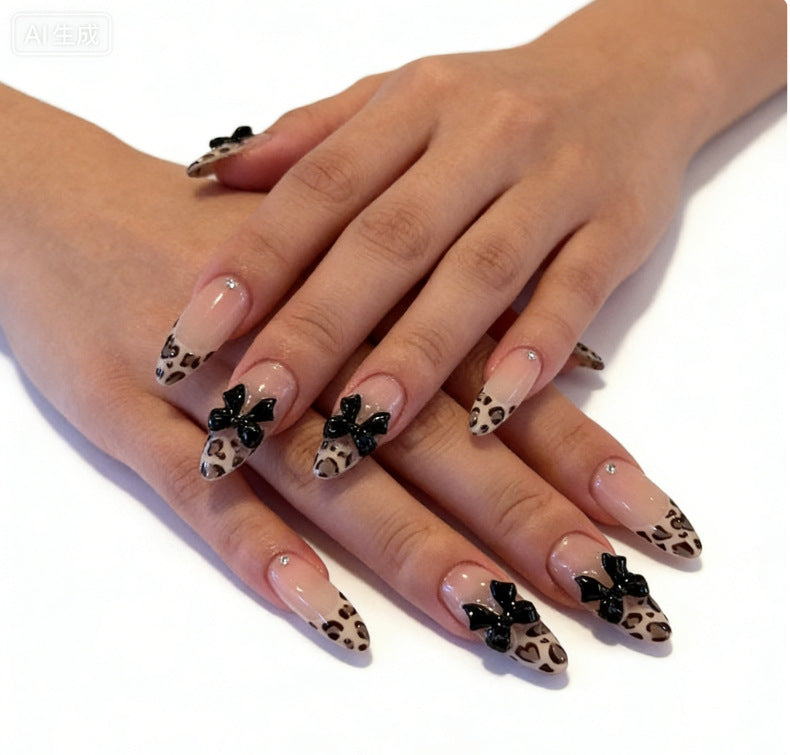 Creative artificial nails with stylish leopard pattern and bow accents Bowlift