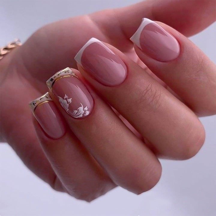 Artful nail art with elegant French tip and floral accents Bowlift