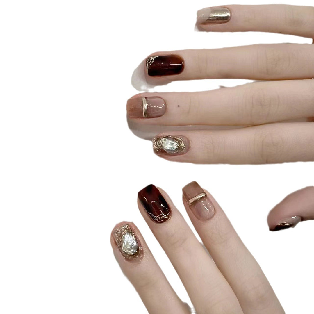 Elegant Nail Art Set with Unique Marble and Metallic Accents Bowlift