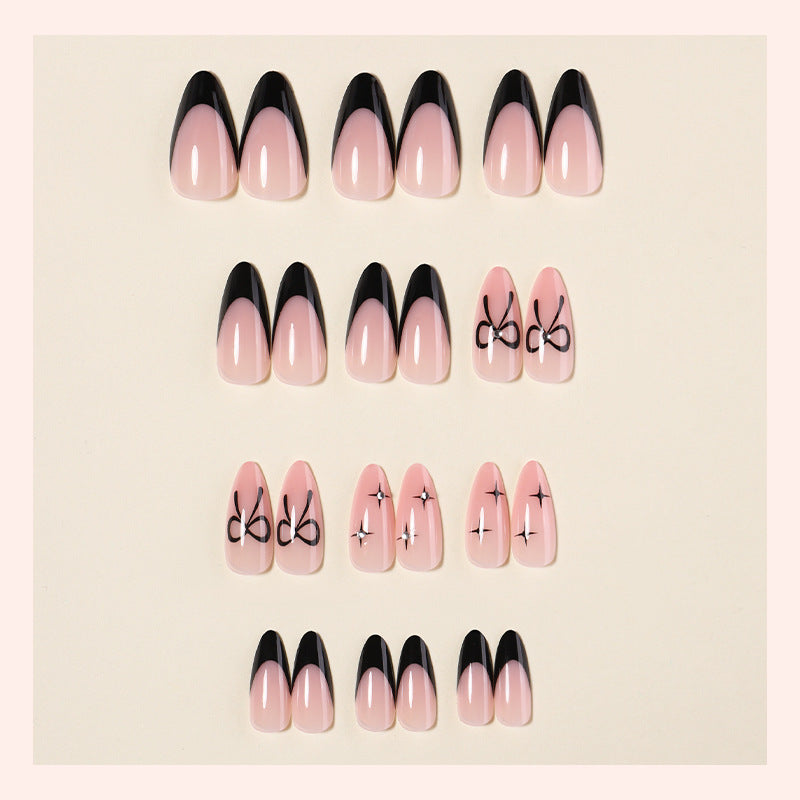Artificial nail set with elegant cut and bow decorations Bowlift
