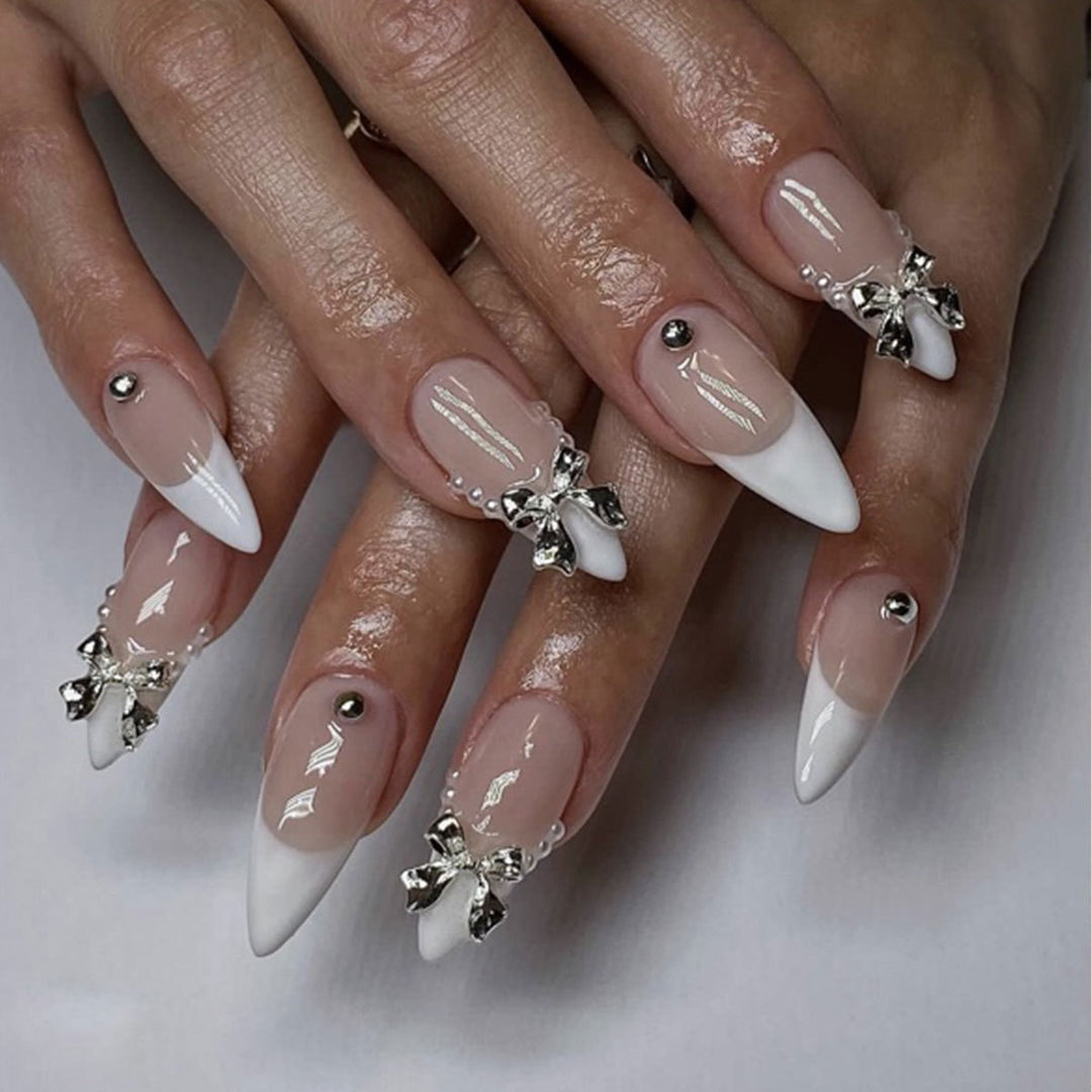 Elegant Stiletto Nail Art with Rhinestone Accents Bowlift