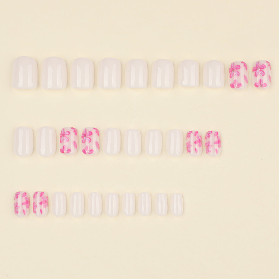 Stylish artificial nail design with floral accents Bowlift