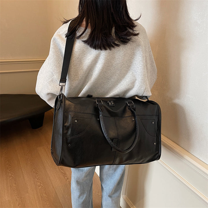 Elegant leather bag with stylish design and versatile carrying options Bowlift
