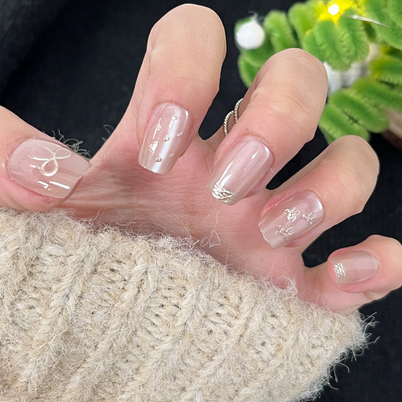 Glossy Nail Art Set with Sparkling Glitter Accents Bowlift