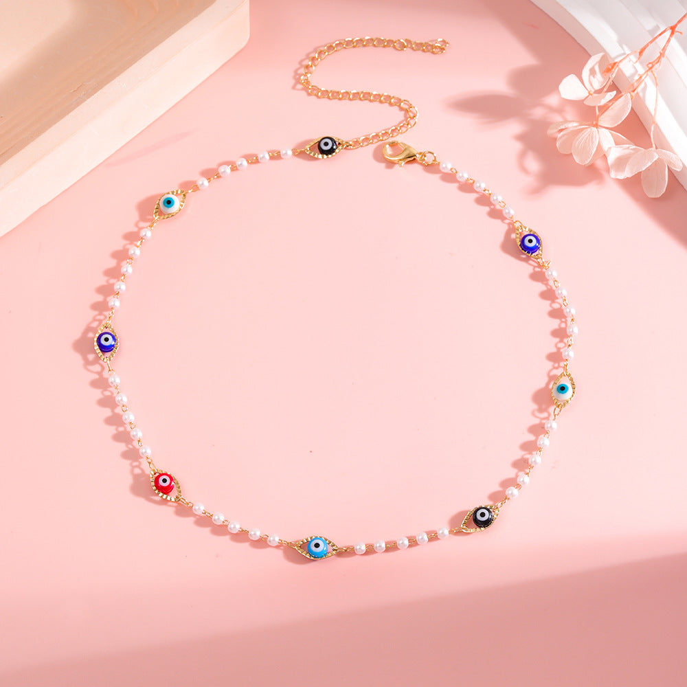 Elegant Pearl and Eye Charm Necklace Bowlift