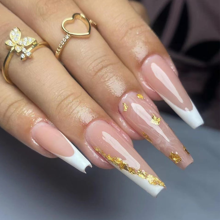 Artistic Stiletto Nails with Glitter and Shine Accents Bowlift