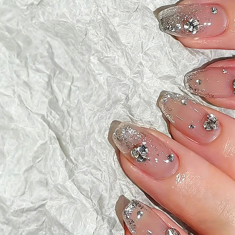 Acrylic nail set with extravagant glitter and crystal embellishments Bowlift