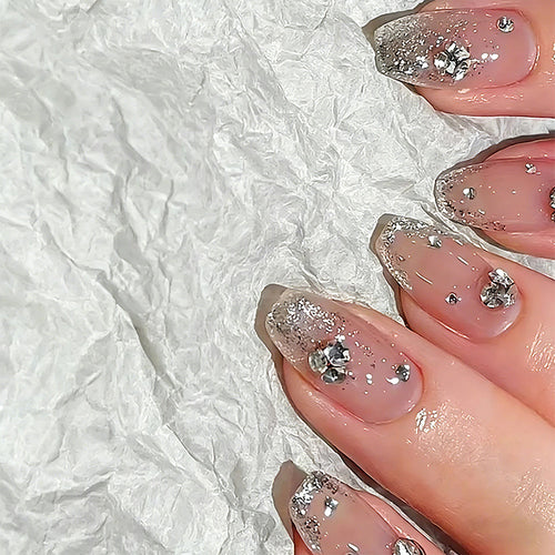 Acrylic nail set with extravagant glitter and crystal embellishments Bowlift